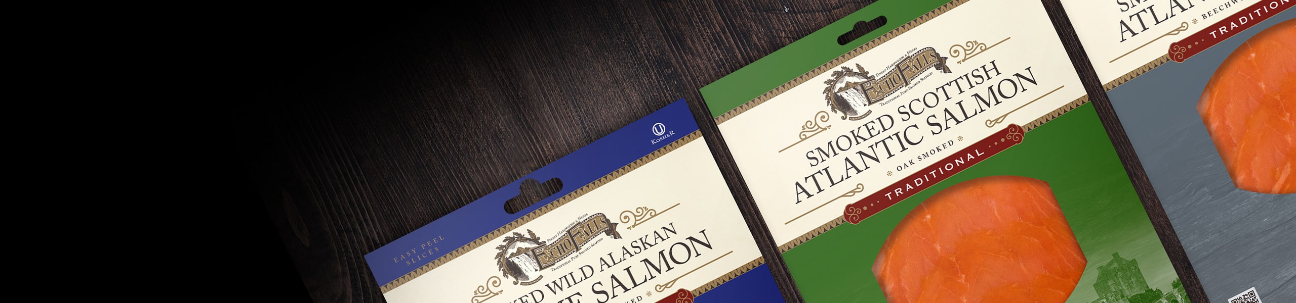 3 salmon packets positioned on wooden desk background